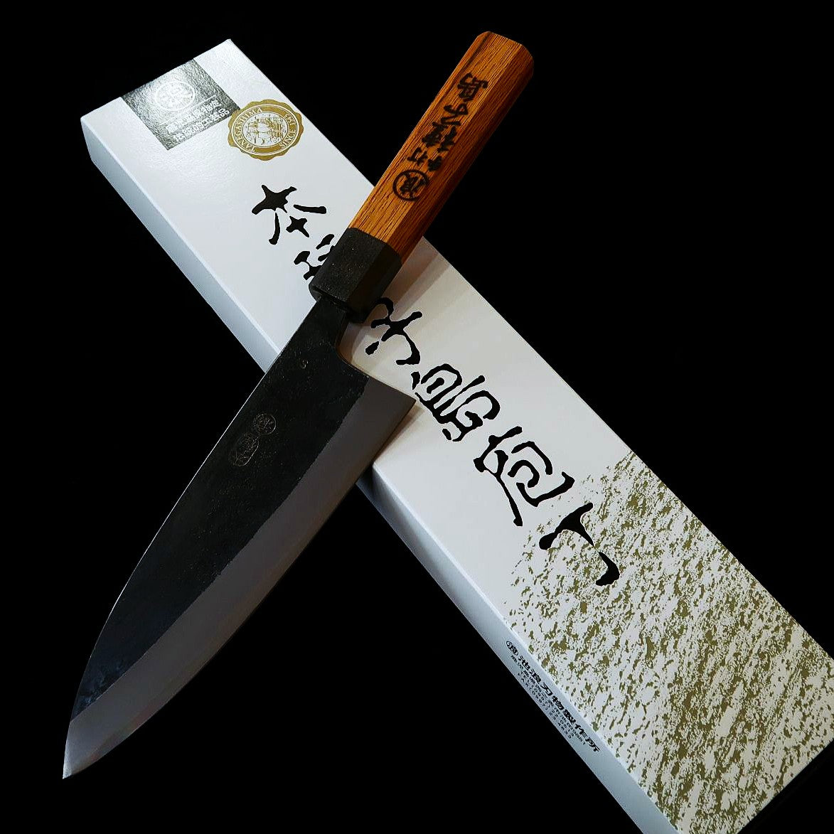 Ikenami Hamono IKENAMI HAMONO aço branco #1 san-mai com inox, cabo em carvalho, deba de fio duplo (130–180 mm)