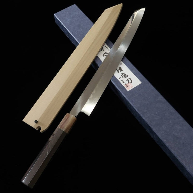 Suisin SUISIN Mizumoto Yaki, fabriqué par Miwa Ikeda, acier Shirogami n°2, manche en ébène, fourreau en magnolia, lame Yanagiba type Ken (300 mm)